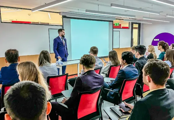 Enrolia founders training an education sales team